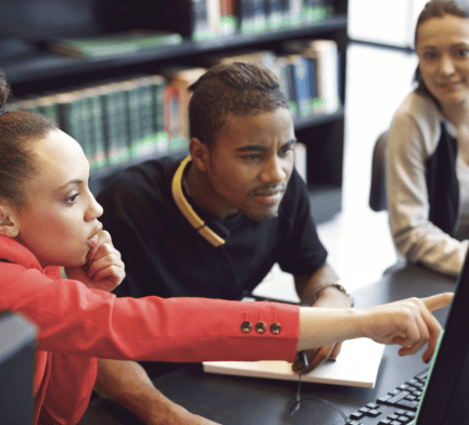 Students looking at computer