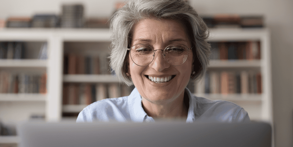 Woman smiling while on laptop