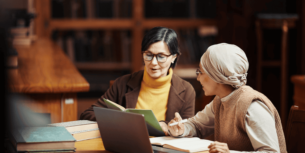 2 women talking in library