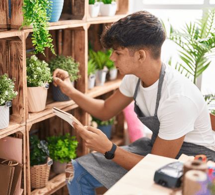 Student taking care of plants